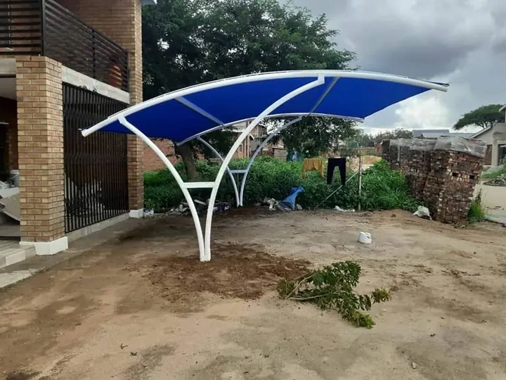 Freshly installed white curved frame with shade net