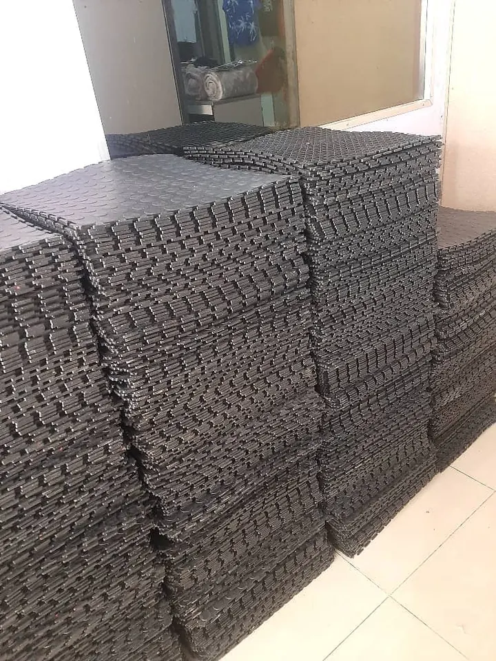 Interlocking tiles stacked and ready for installation